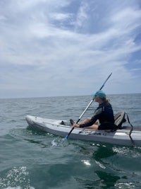 a person on a paddle board in the ocean